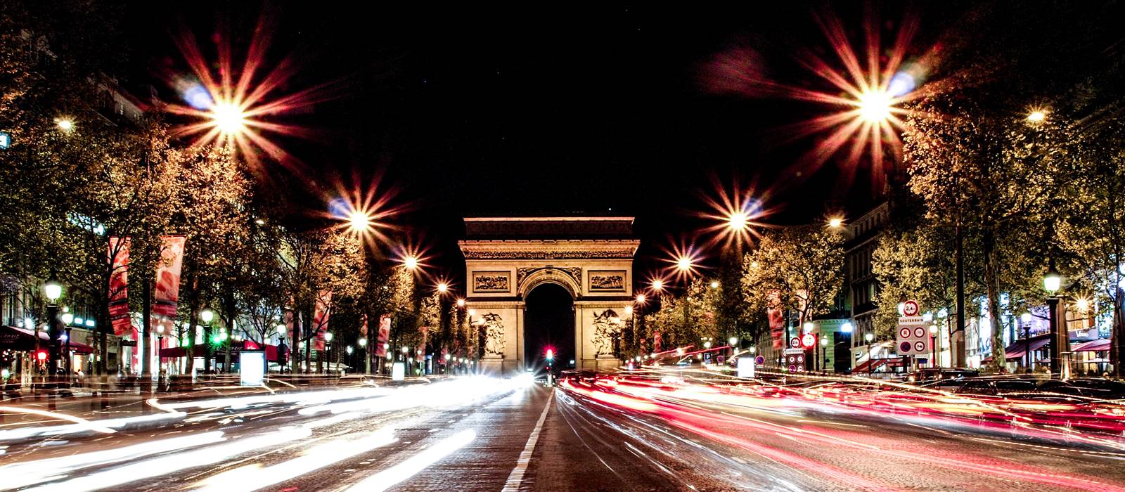 Street view of Champs-Elysees Avenue with building LOUIS VUITTON